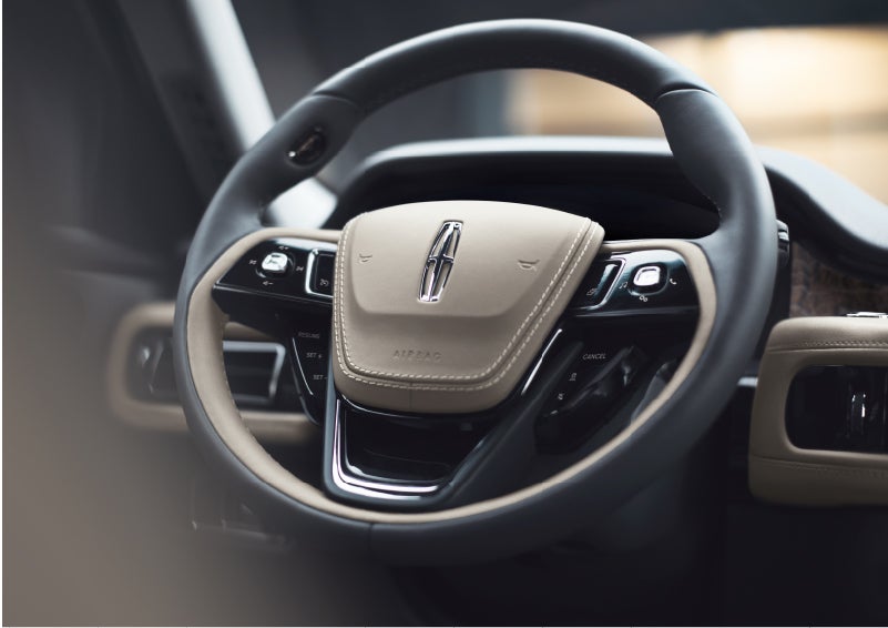 The intuitively placed controls of the steering wheel on a 2023 Lincoln Aviator® SUV | Ted Russell Lincoln in Knoxville TN