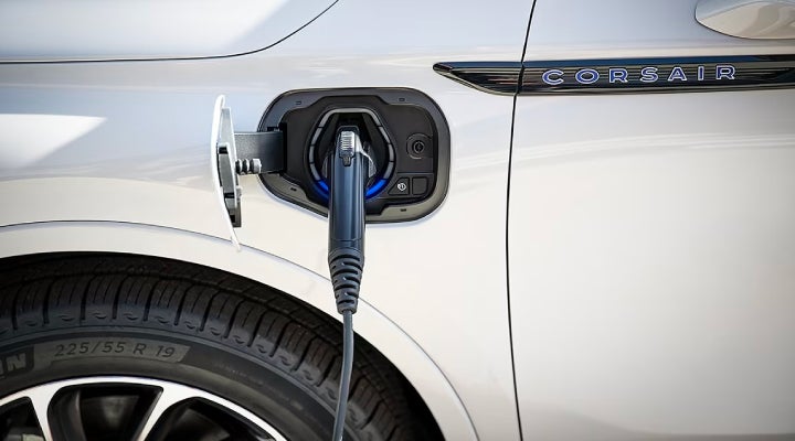 An electric charger is shown plugged into the charging port of a Lincoln Corsair® Grand Touring
model. | Ted Russell Lincoln in Knoxville TN